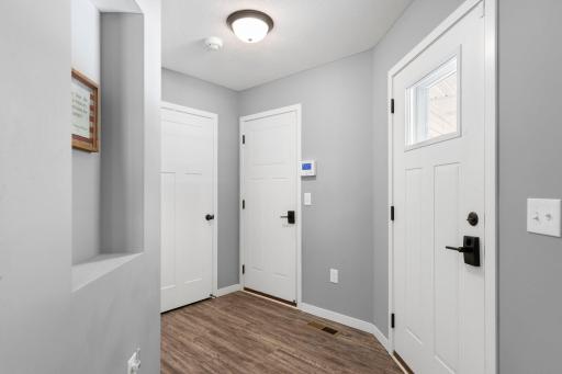 Back hall leading to backyard, garage or a storage/utility room.