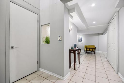 The lower level features large storage spaces and a private guest suite