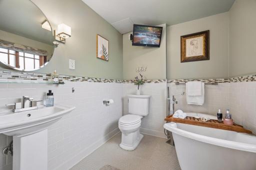 The walkout level bath offers a spa-like escape, designed for relaxation and everyday comfort