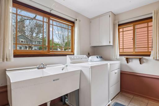 Family room level features a bright and sunny laundry room