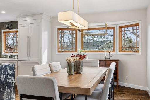 The dining area features a charming bay window, creating the perfect spot for meals with a view