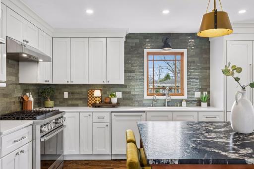 Custom cabinetry continues seamlessly to the French door refrigerator, blending function and style while keeping the look clean and cohesive