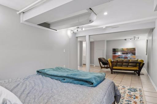 Bedroom with sitting area is perfect for a guest suite, play space or game/hobby space