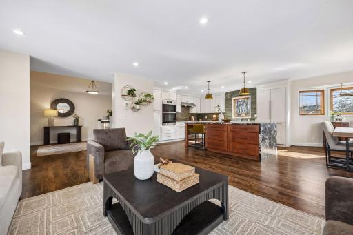 A thoughtfully removed wall transformed this space, enhancing the flow and allowing light to move freely throughout the main level