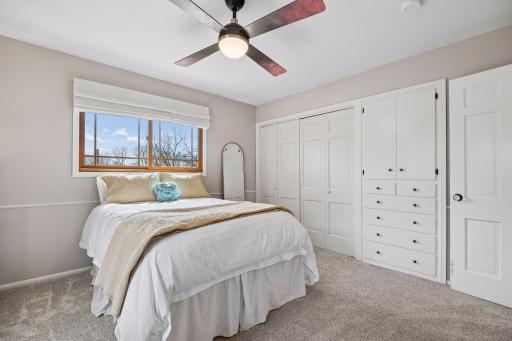 2nd large bedroom originally designed as a primary bedroom features built in storage in addition to large closet space