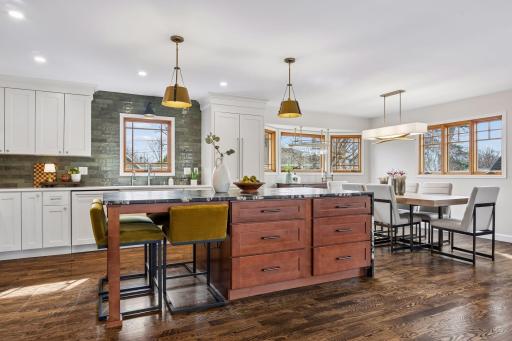 The kitchen is thoughtfully designed for both function and style and flows seamlessly to the dining area