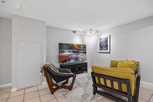Lower level bedroom features a private sitting area