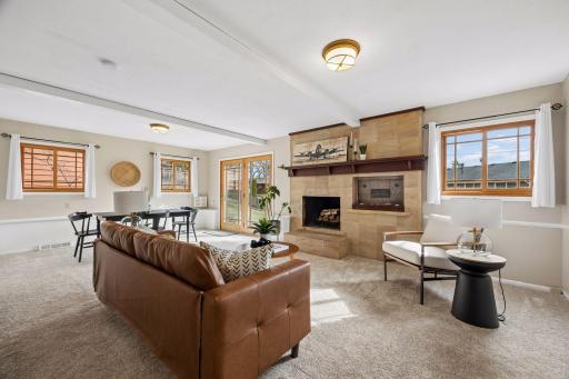 The walkout level family room offers a spacious, light-filled retreat with room to relax, gather, or spread out