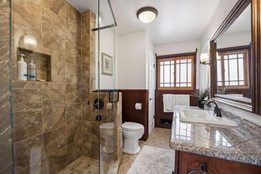 Gorgeous bedroom level bath with oversized step in shower