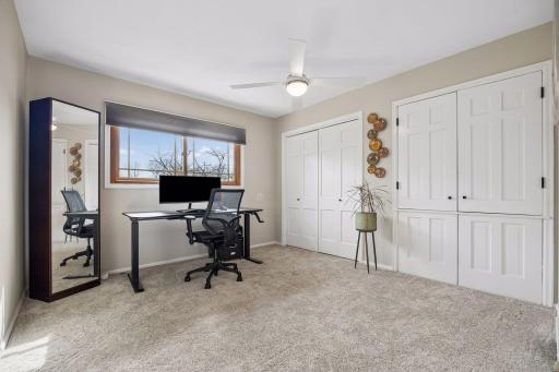 Overlooking the backyard, this third upper level bedroom features great storage and a comfortable, versatile layout