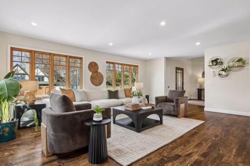 Gorgous hardwood floors and tons of windows enhance the open floorplan