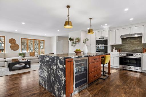 Thoughtful extras like a built-in beverage fridge and generous prep space make this kitchen as practical as it is polished, truly the heart of the home
