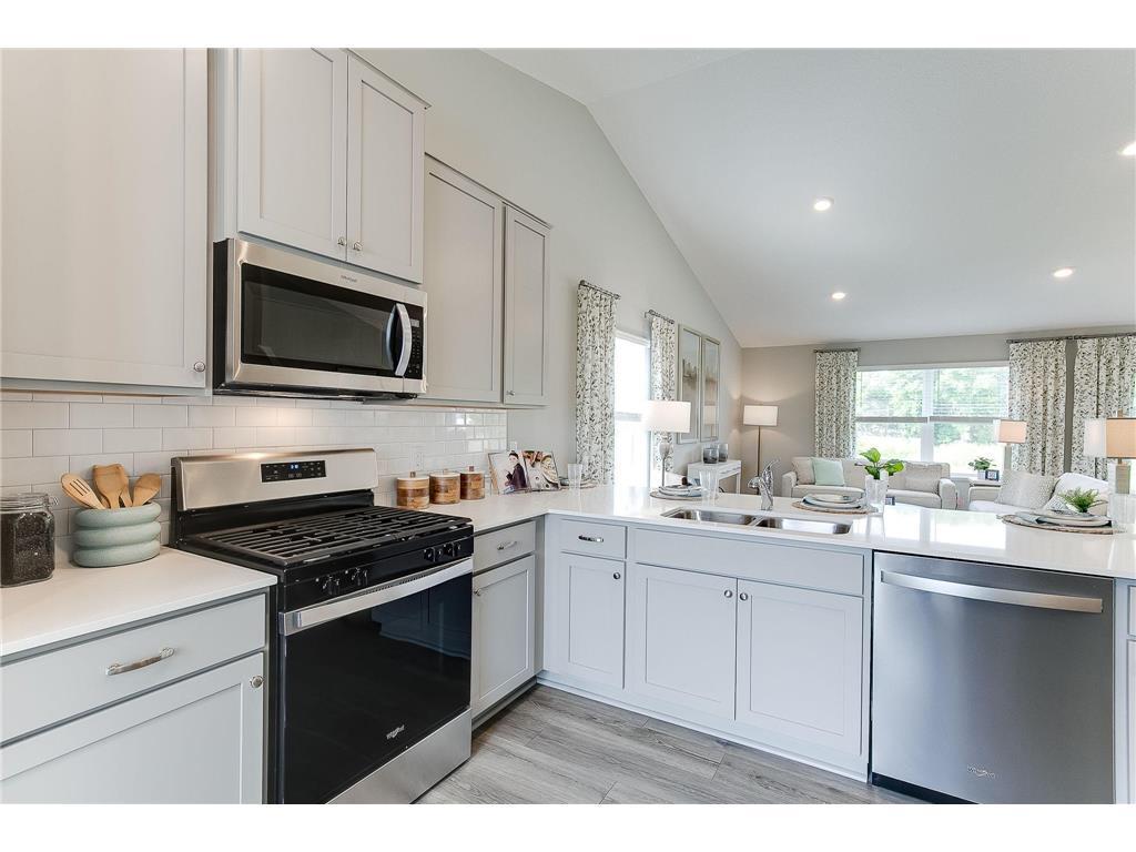Includes a stainless gas range, microwave, dishwasher and disposal
