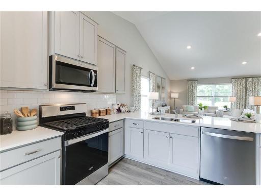 Includes a stainless gas range, microwave, dishwasher and disposal