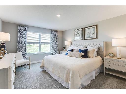 Spacious primary bedroom is the perfect place to relax at the end of the day