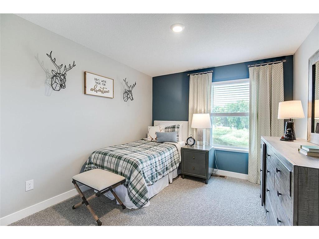 One of three bedrooms on the upper level