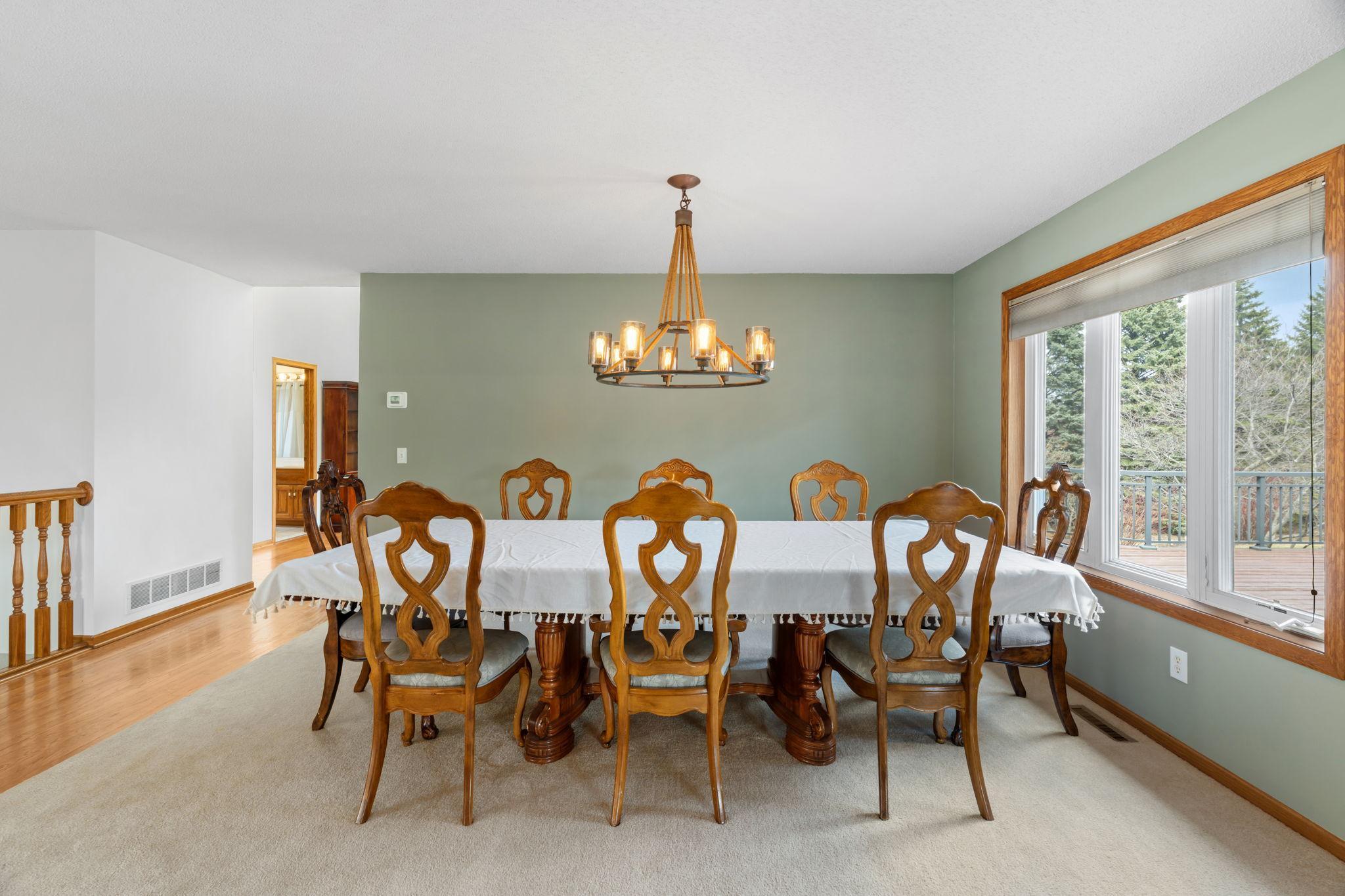 Gather and celebrate in this generously sized formal dining room, comfortably seating eight or more guests with ease while the large picture window floods the space