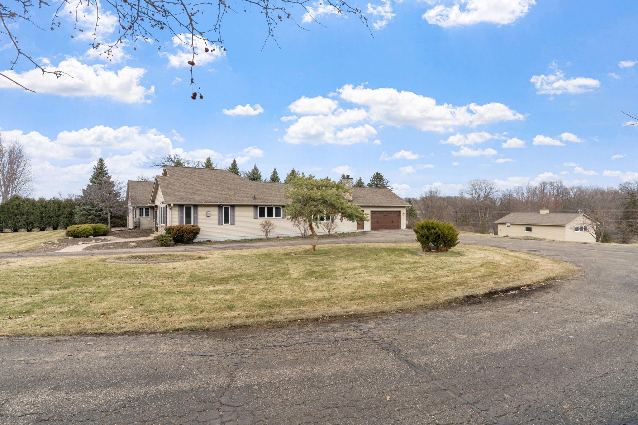 Wrap around driveway making in and out easy access - convenience!