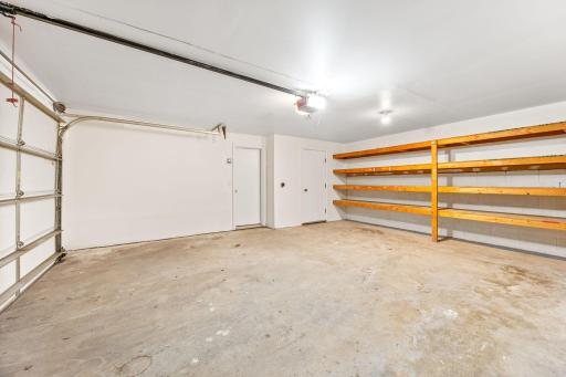Newly painted Garage! Shelving galore!
