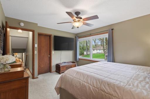 Primary bedroom has large custom walk-in closet