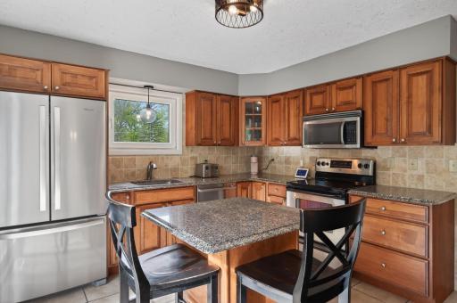 Kitchen features newer SS appliances & granite counter tops