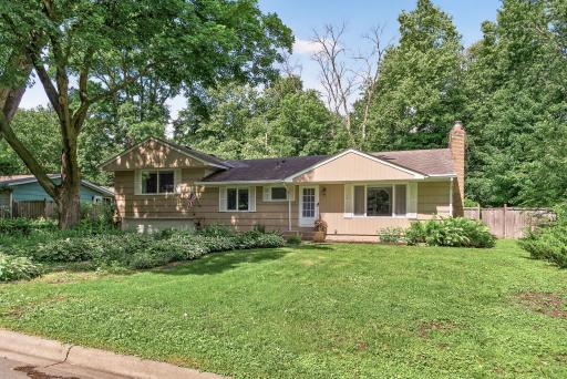 Hostas in full bloom pave the way up to the home.