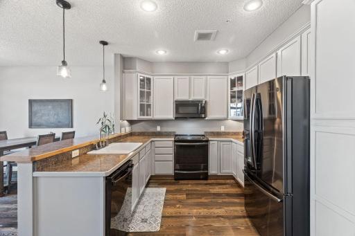 The large kitchen has updated appliances, including a gas range.