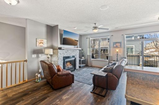 The fireplace has been upgraded with beautiful stone.