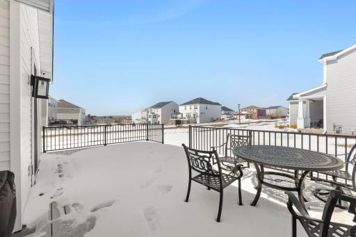 Spacious, maintenance-free back deck overlooking the large corner lot with in-ground irrigation.