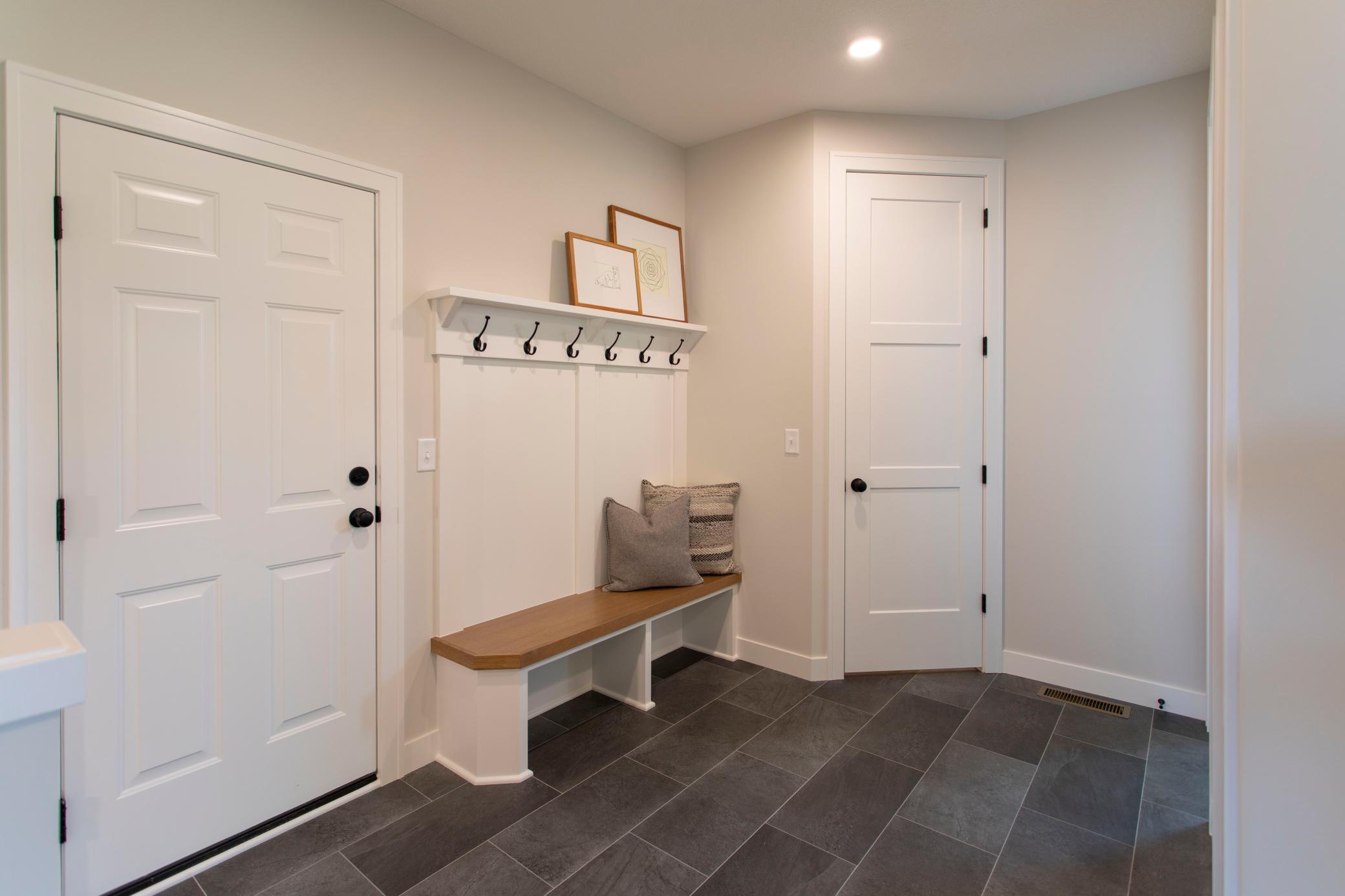 Main Level Mudroom w/bench & walk in closet