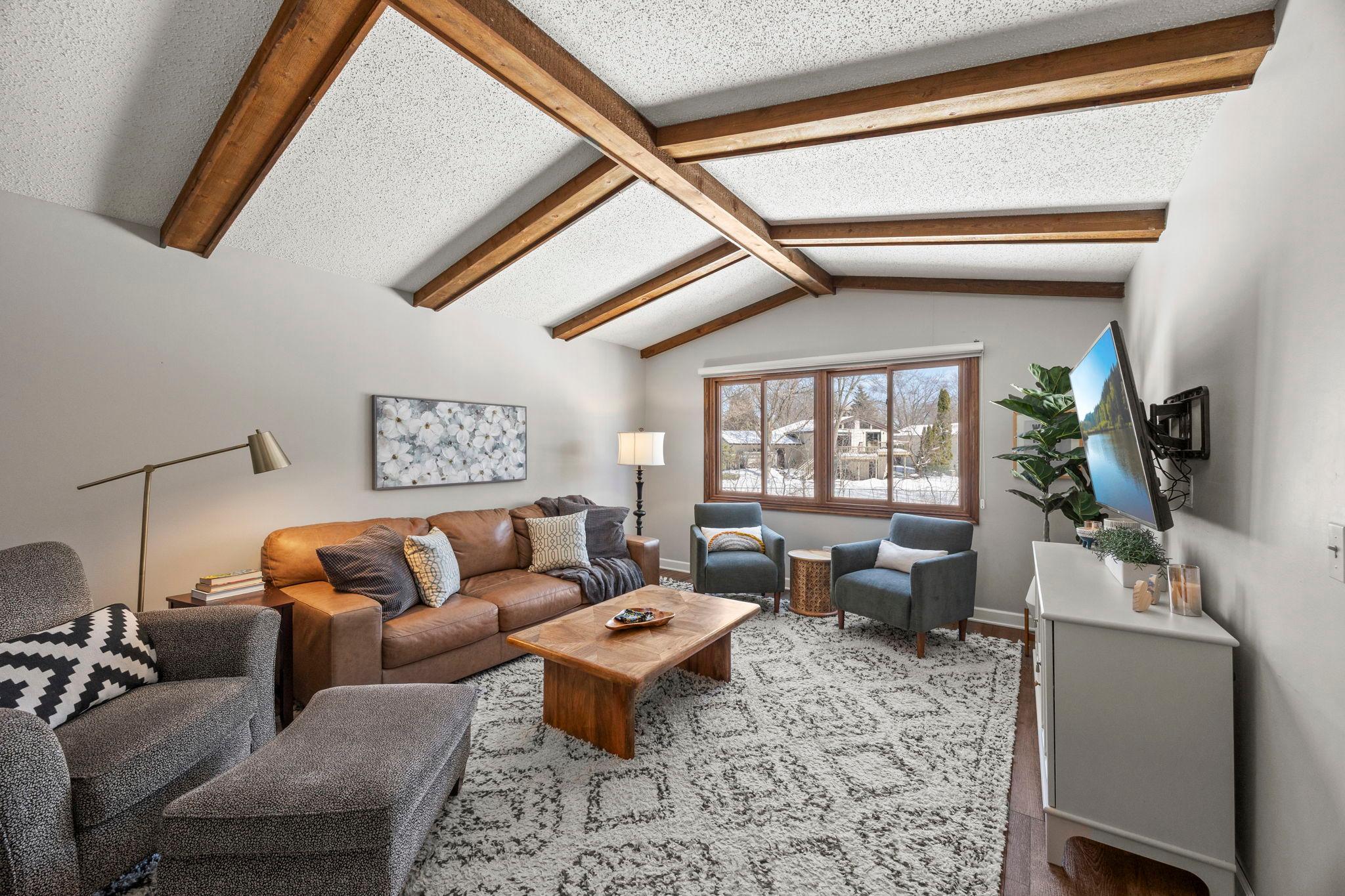Beamed and vaulted ceiling create character in the living room