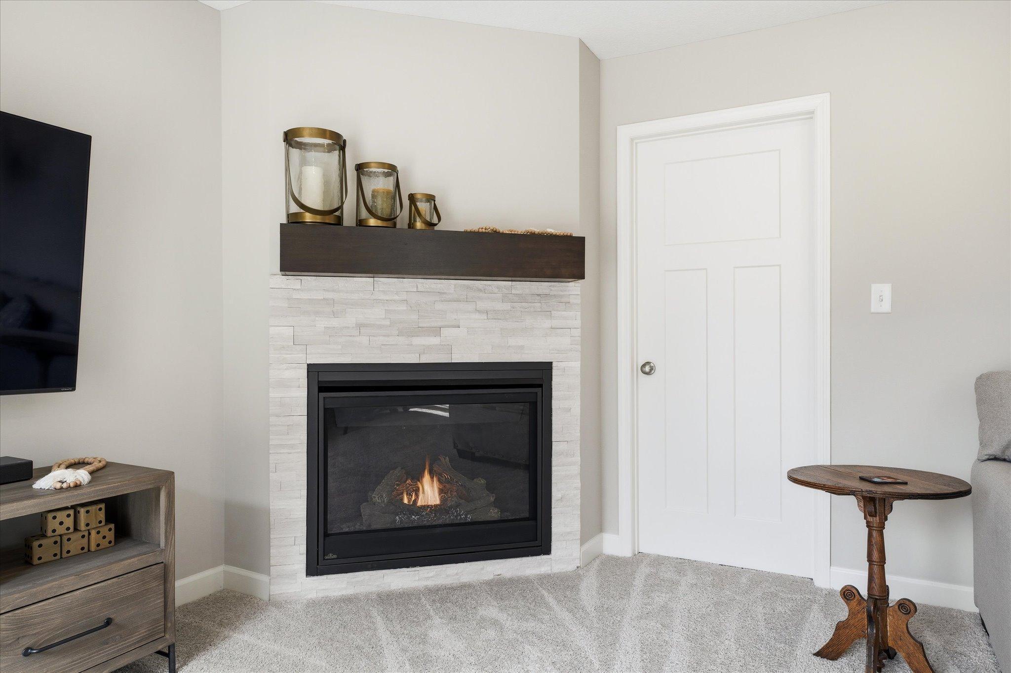 Gorgeous gas fireplace is perfect addition to the lower level family room