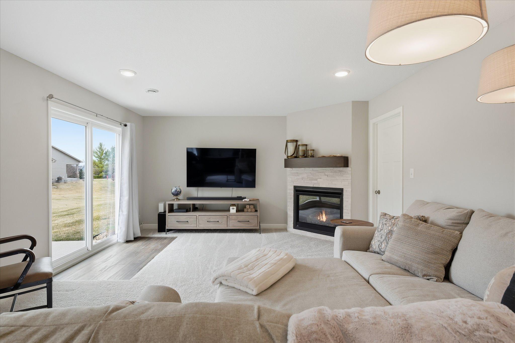 Lower level family room with gas fireplace and walk-out to patio area.