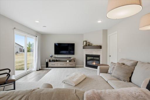 Lower level family room with gas fireplace and walk-out to patio area.