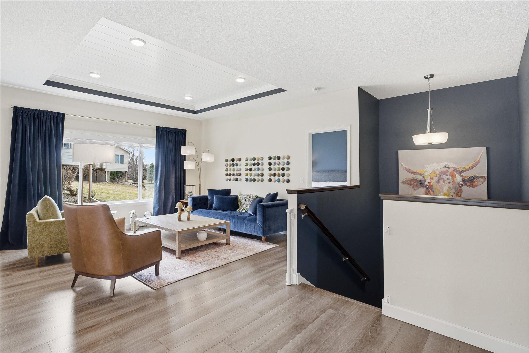 Open yet warm living room with dramatic ceiling features.