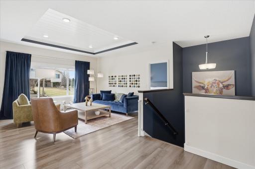 Open yet warm living room with dramatic ceiling features.