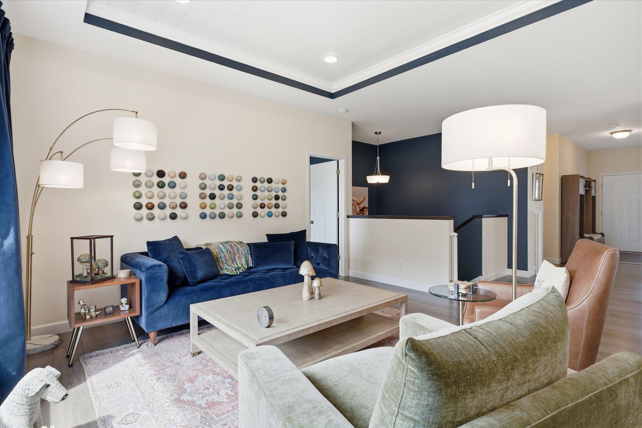 Open yet warm living room with dramatic ceiling features.