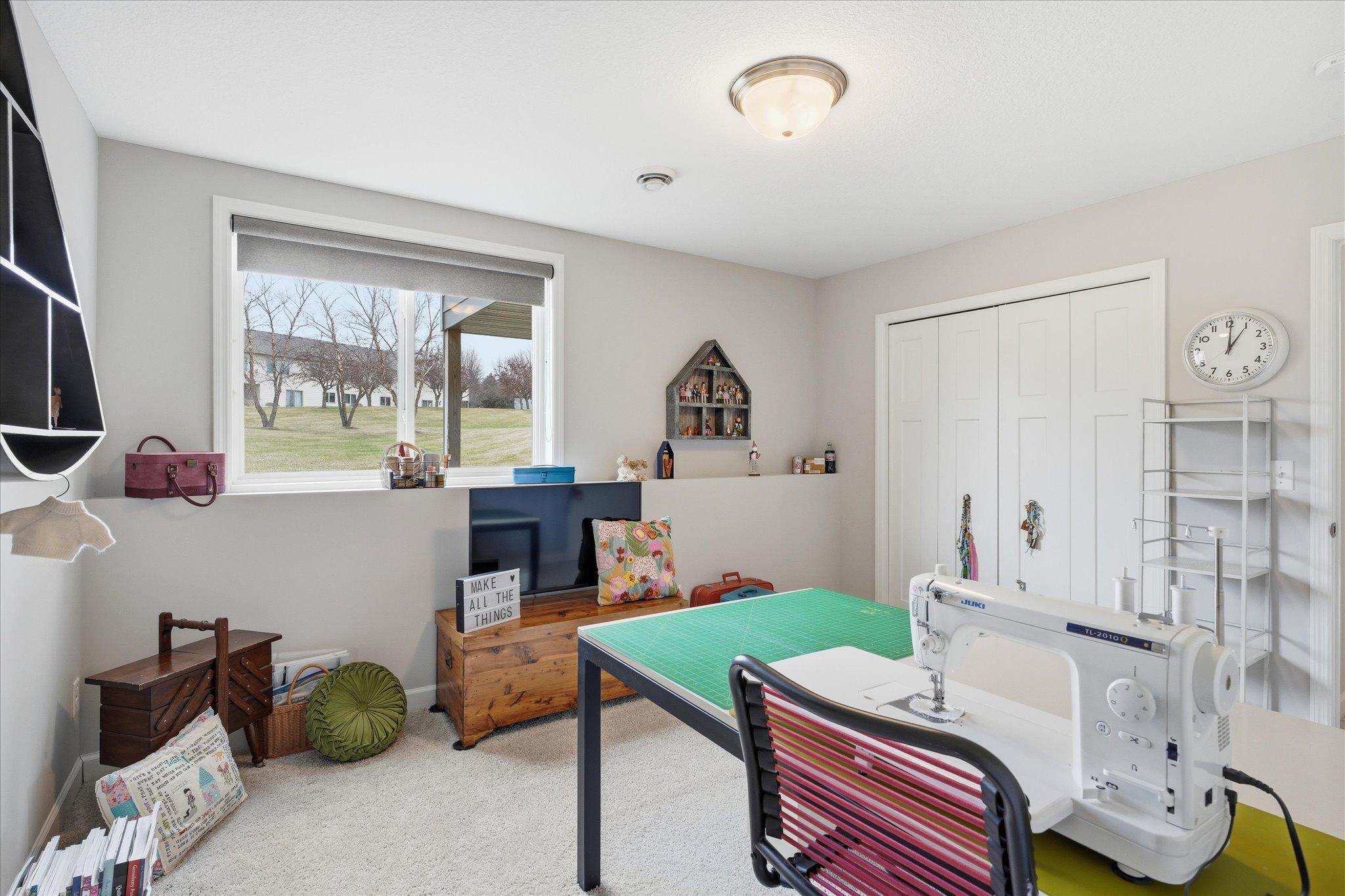 Large bedroom 4 in lower level currently used as a sewing room.