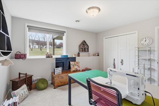Large bedroom 4 in lower level currently used as a sewing room.