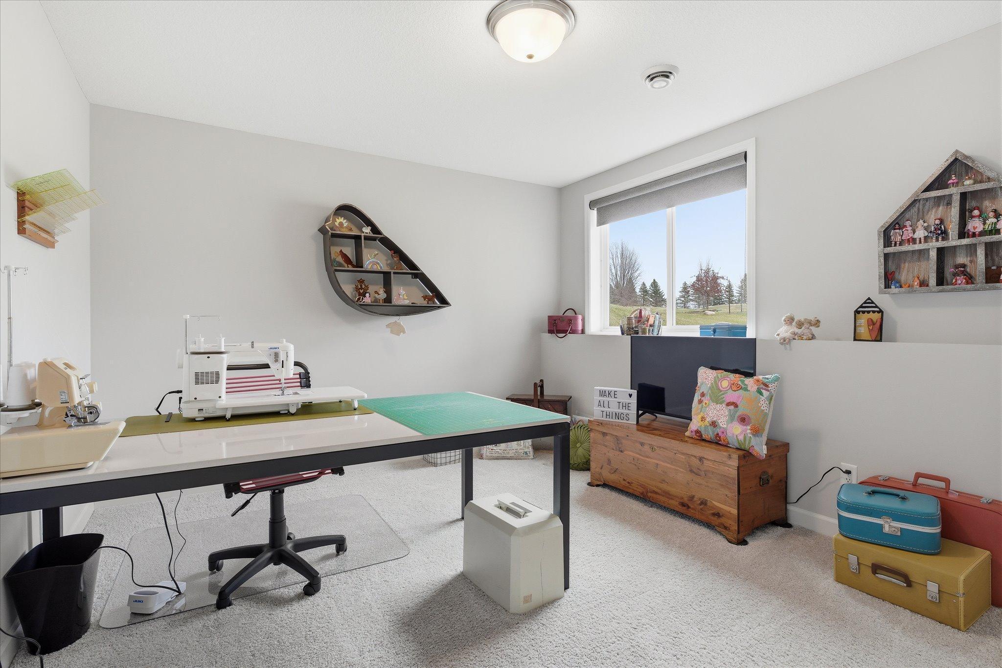 Large bedroom 4 in lower level currently used as a sewing room.