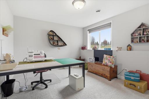 Large bedroom 4 in lower level currently used as a sewing room.