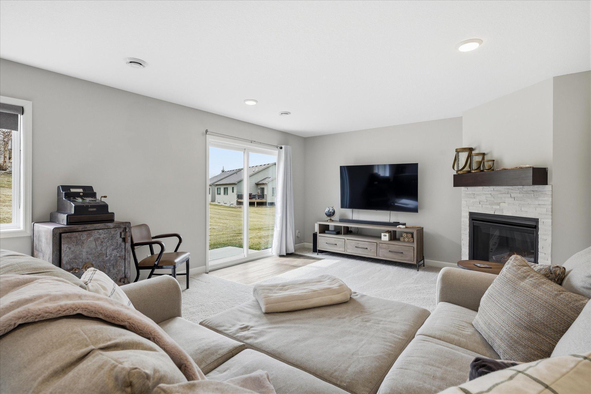 Lower level family room with gas fireplace and walk-out to patio area.