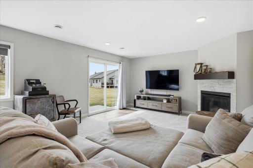Lower level family room with gas fireplace and walk-out to patio area.