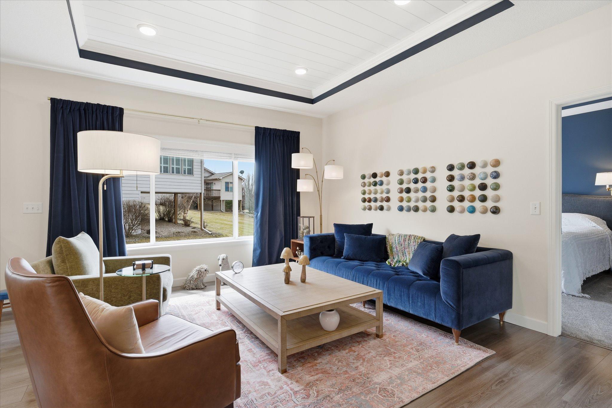 Open yet warm living room with dramatic ceiling features.