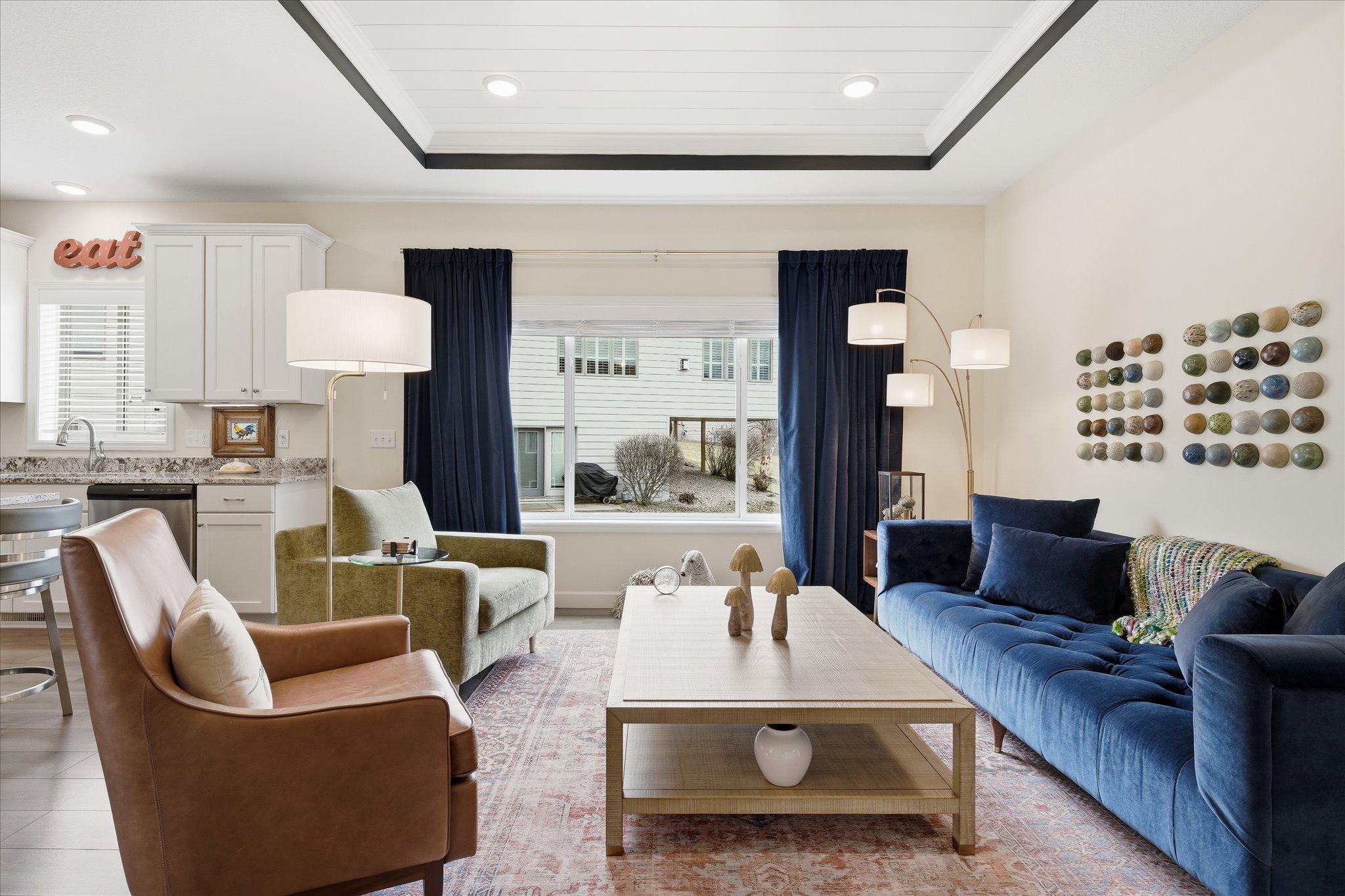 Open yet warm living room with dramatic ceiling features.