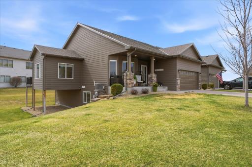 The home has only one side neighbor. To the other side is open community green space with a garden to enjoy.