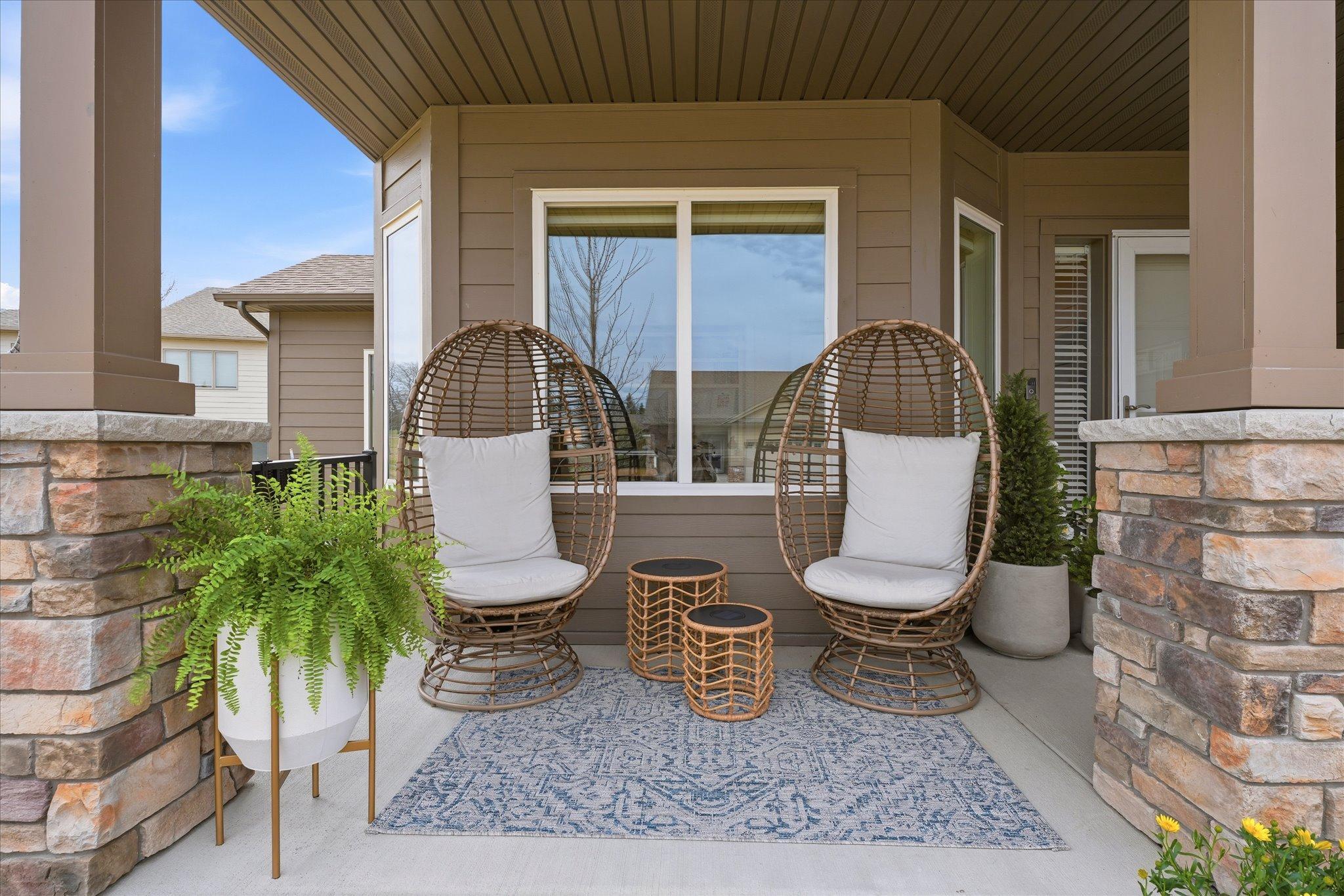 Greet your guests on your covered front porch! Even a couple extra parking spots off to the side by the community garden.