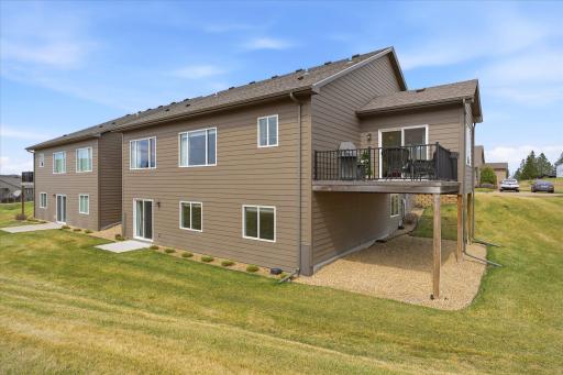 Awesome backyard area with patio off the lower level walk-out, as well as the deck off the kitchen and 4-season sunroom