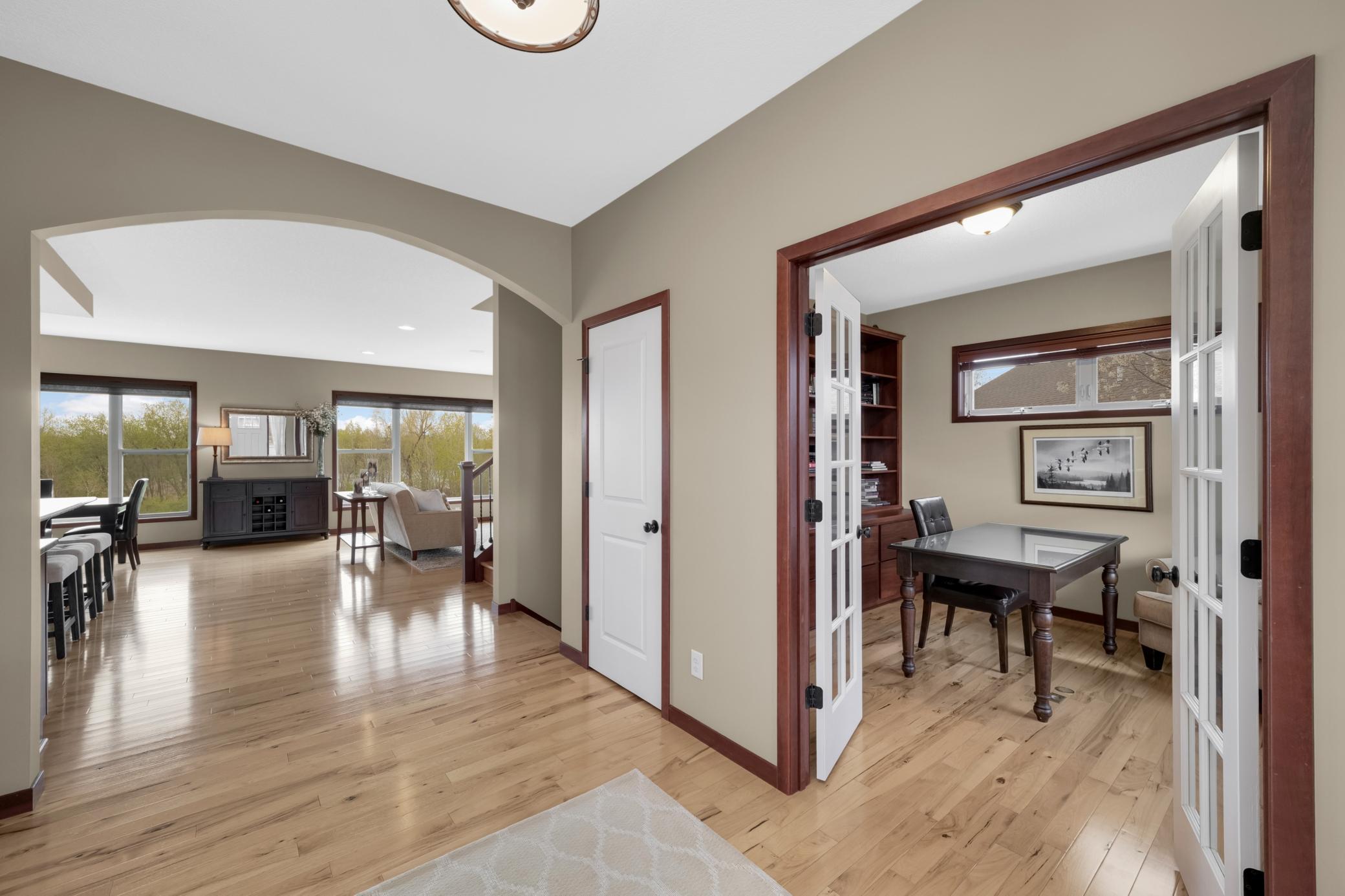 Rich hardwood floors greet you upon entry and continue throughout the inviting main level. Main floor Office with upgraded windows and built in bookshelfs.