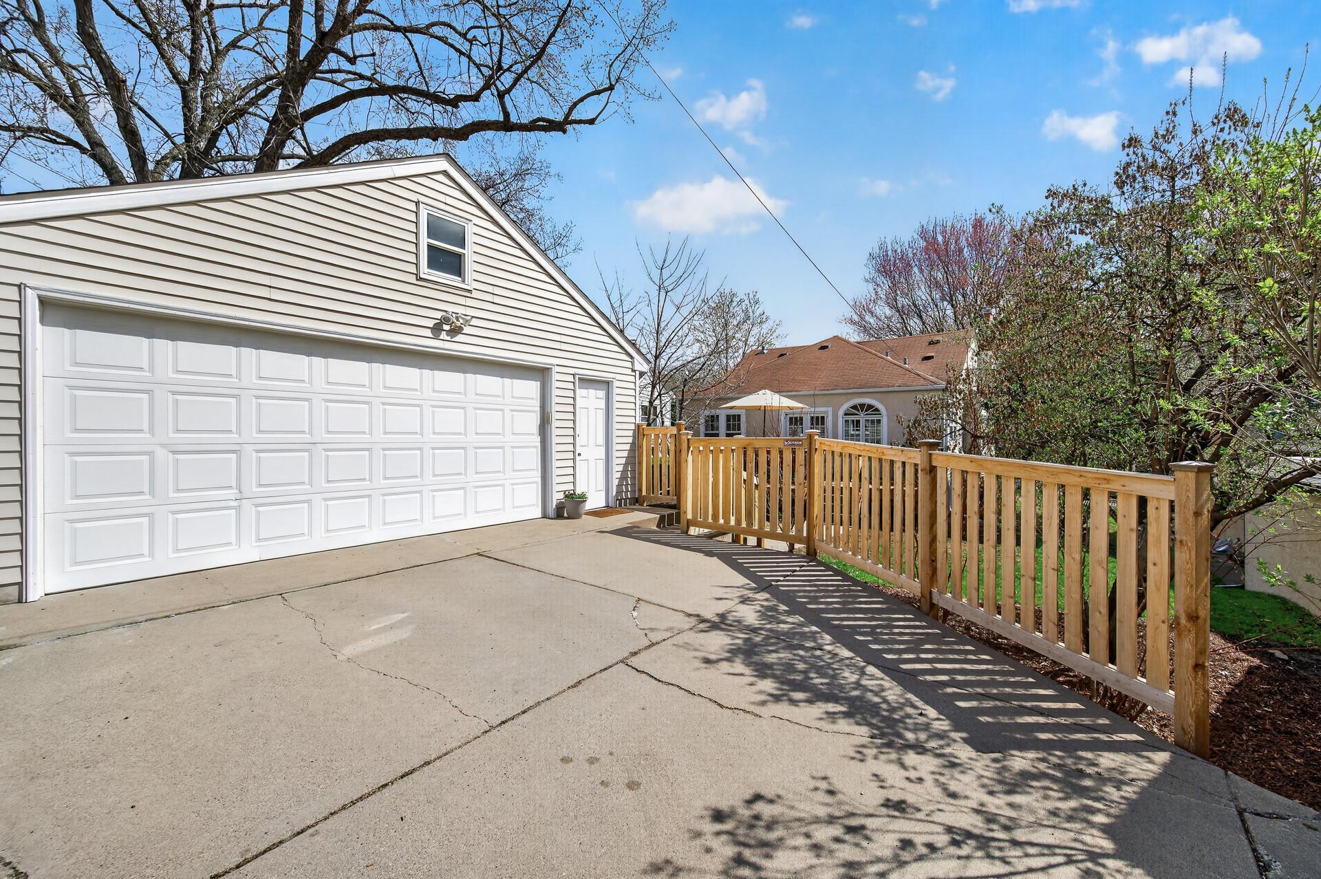 Oversized garage with concrete driveway